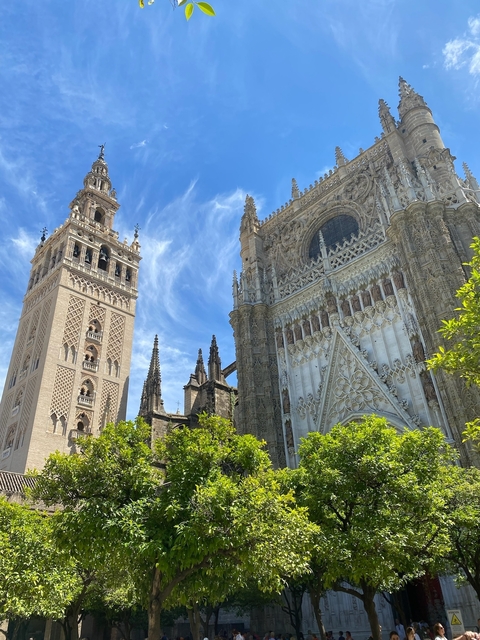 Giralda tower and cathedral with clear blue sky.
