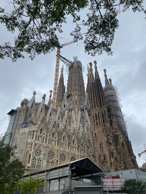      Under-construction Sagrada Familia with cranes.
  