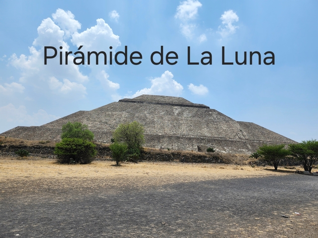       Pyramid in daylight with text overlay.
  