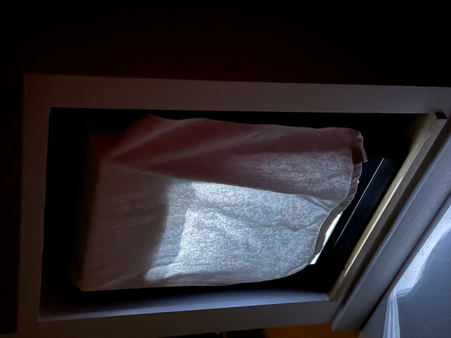       A window panel with light coming through.
  