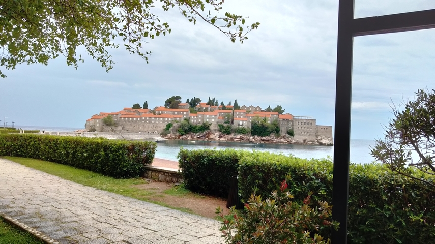 Coastal view of a historic island with buildings.