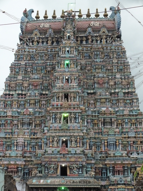 Intricately carved and colorful temple facade in India.