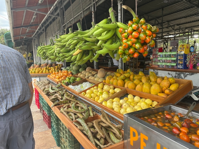 A vibrant display of various fruits in a market setting.