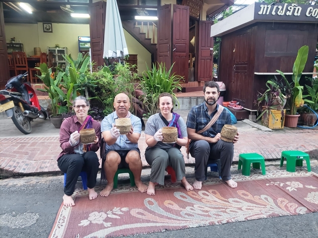 Group of people sitting on stools with handmade baskets.