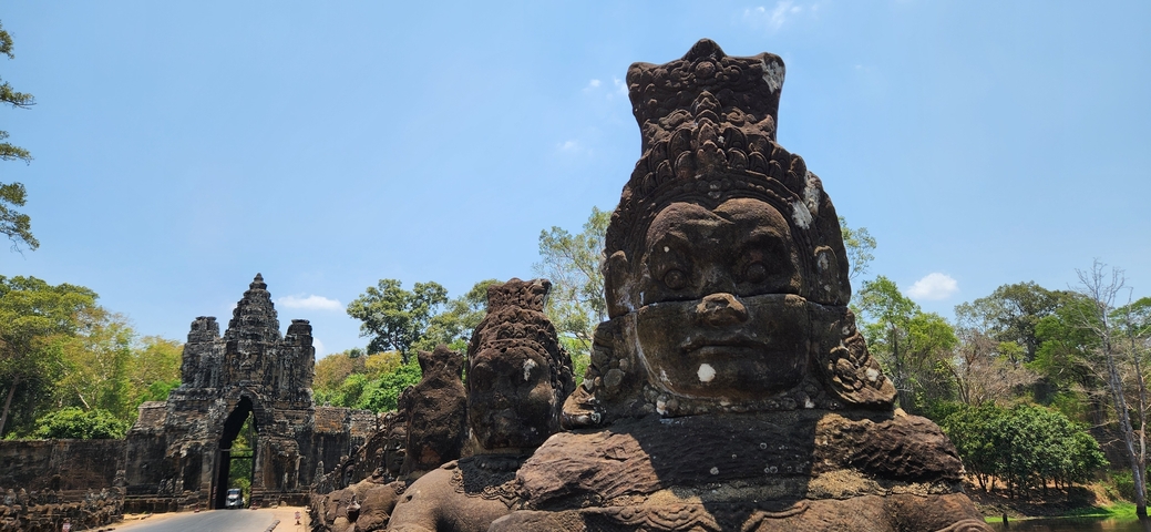 Stone statues at the entrance of an old temple.
