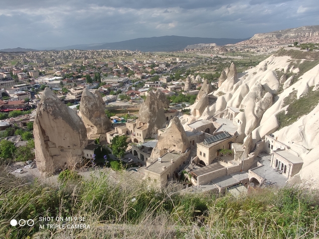Panoramic view of a town with unique rock formations.