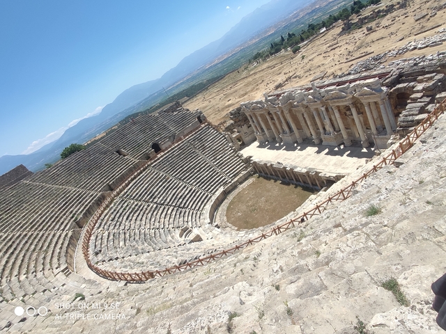       Roman theater ruins with a panoramic view.
  