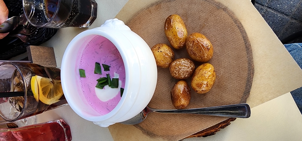 Traditional beet soup with potatoes served on a platter.