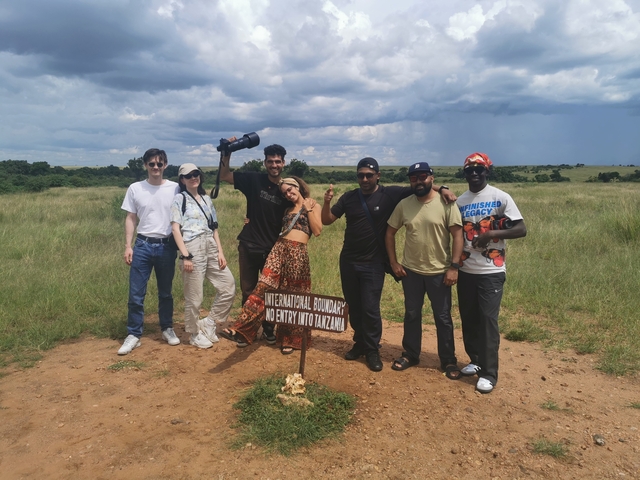 Group of people at an international boundary during a safari.
