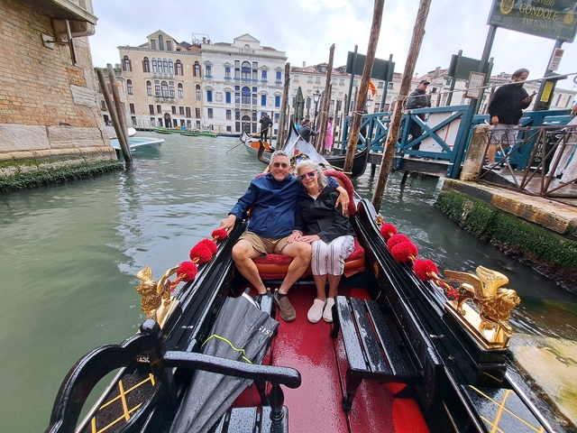 Couple enjoying a gondola ride in Venice