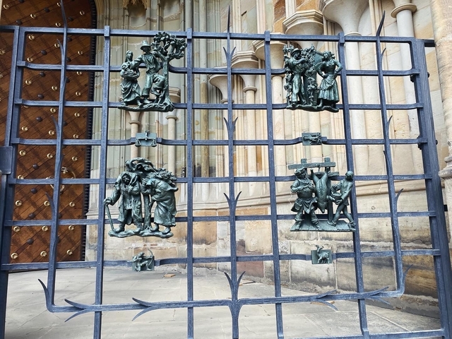Decorative gate with sculptures in a historic site.
