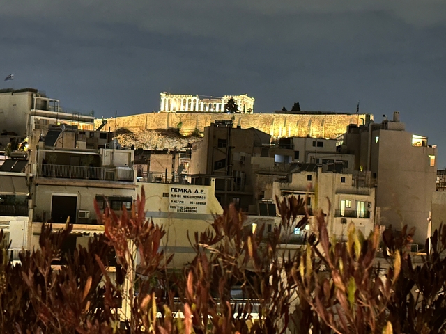       Illuminated Acropolis at night.
  