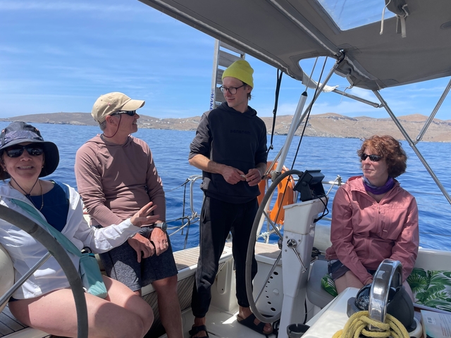       Group of friends enjoying a yacht ride.
  