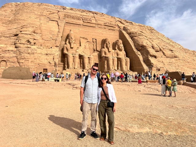 Tourists posing in front of the Abu Simbel Temples.