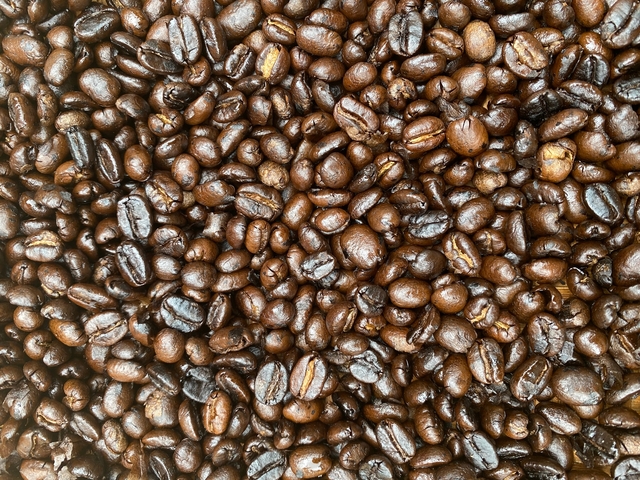       Close-up of coffee beans with texture details.
  