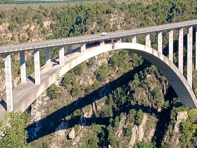 High arch bridge over a deep gorge.