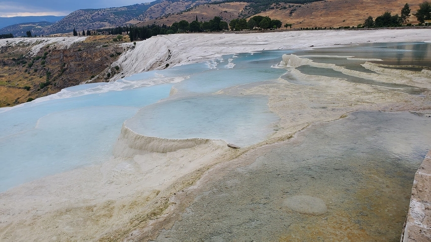Natural thermal pools with clear blue water.