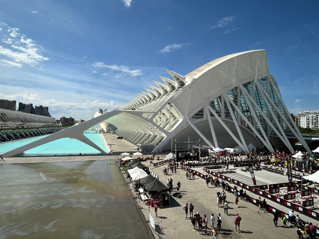       Modern architectural complex with a large pool and gathering area.
  