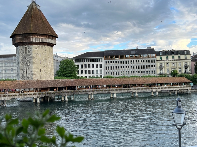Historic wooden bridge over a water canal.