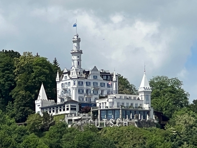 White castle building atop a hill.