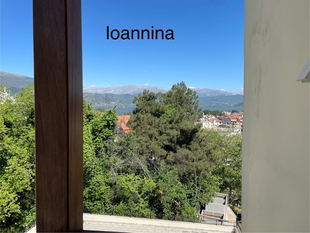       View from a window with the text 'Ioannina'.
  
