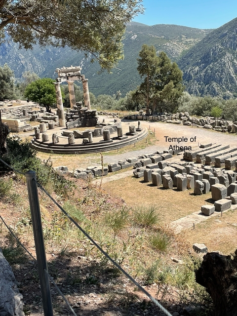       Ancient ruins with a sign labeling the Temple of Athena.
  