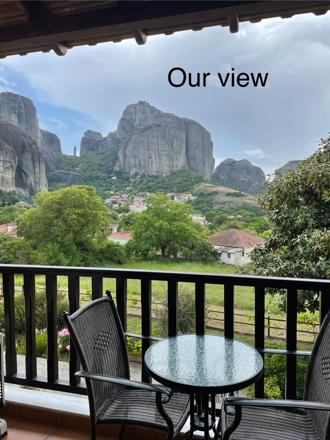       A view of rock formations with a village.
  