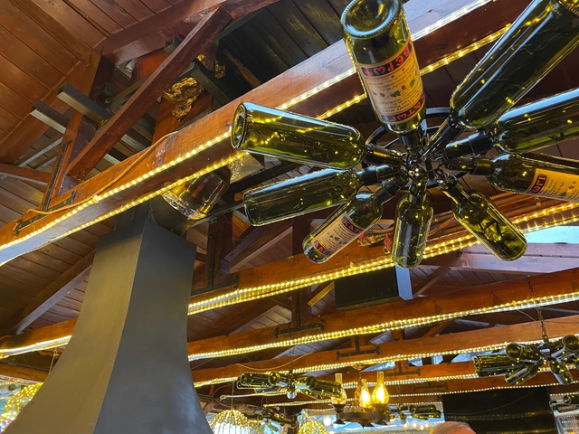       Hanging decorative items made from wine bottles.
  