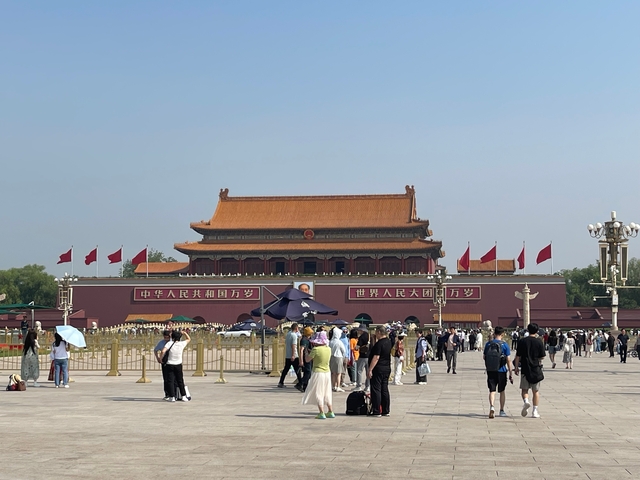 A historic square crowded with people.