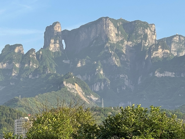       Dramatic mountain peaks with a hole in one.
  