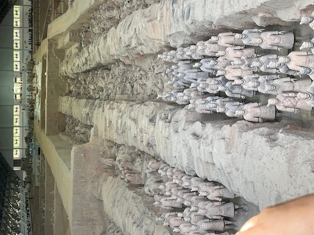 Terracotta Army display in a museum setting.