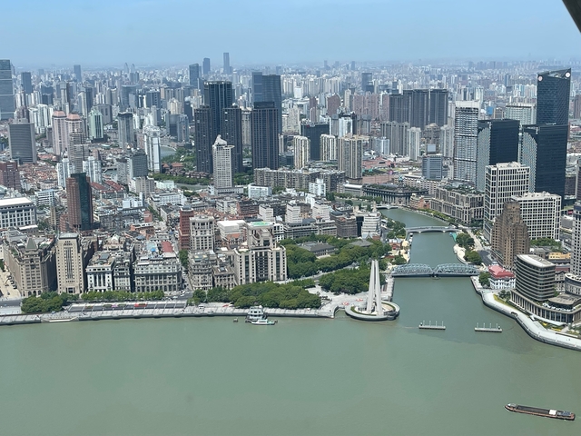 A cityscape with rivers and numerous skyscrapers.