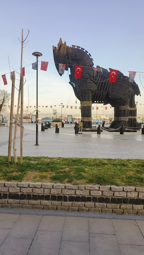 Large wooden structure of a horse in a public square