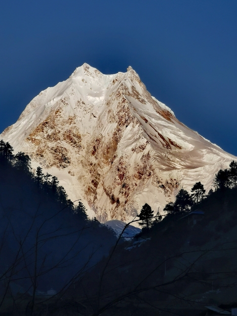       Close-up of a snow-covered mountain peak
  