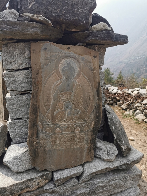       Stone carving of a historical figure
  