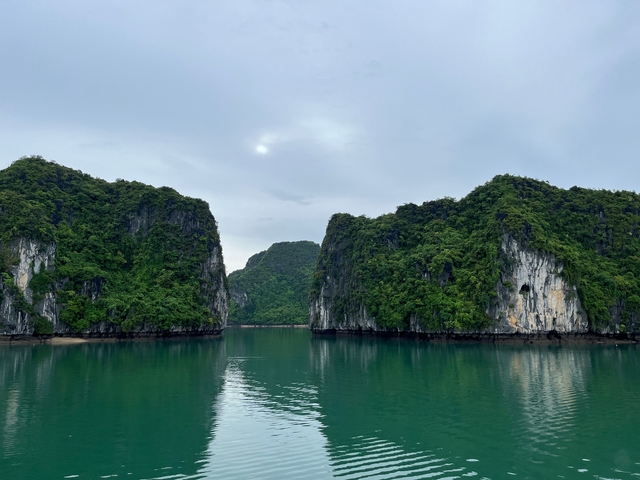 Scenic view of limestone karsts and calm waters.