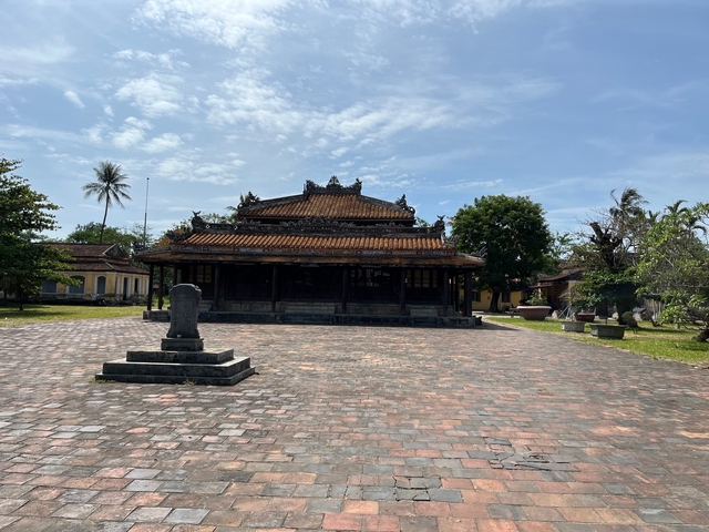 Traditional Vietnamese architecture with blue sky.