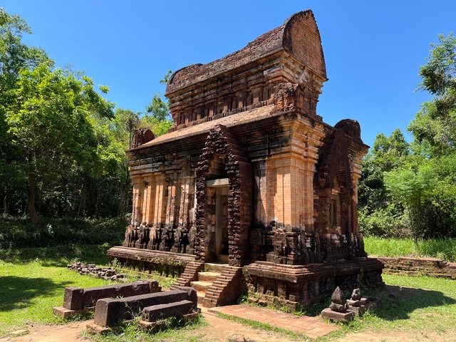       Ancient brick temple surrounded by trees.
  