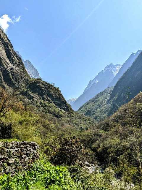      Scenic view of mountain valleys with clear blue sky.
  
