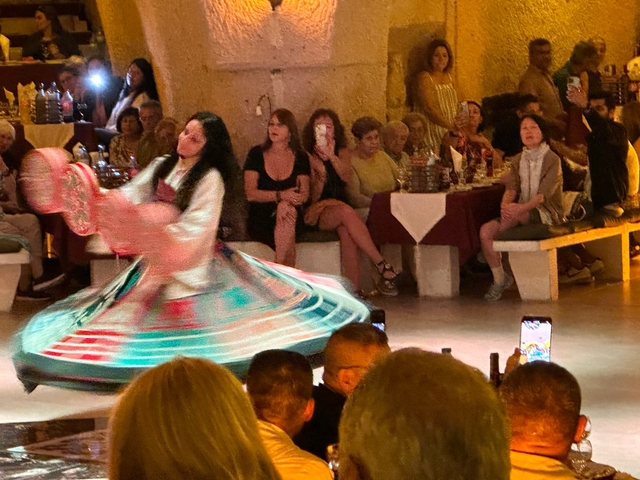       Traditional dance performance with a colorful spinning dress.
  