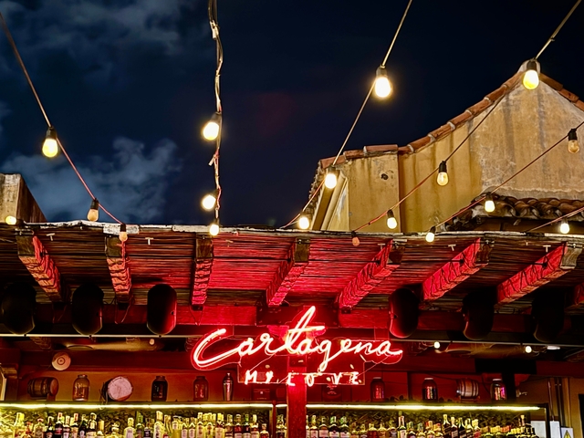       Night scene with illuminated Cartagena sign.
  