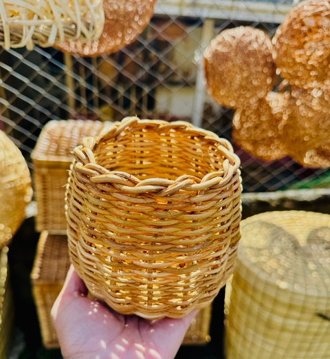       Close-up of a woven basket in a market setting.
  