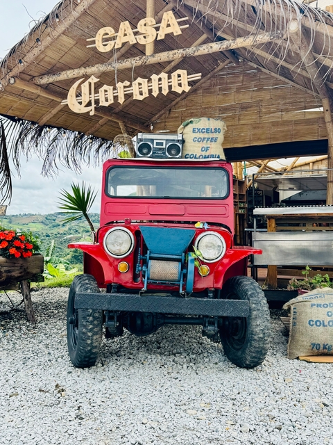       Colorful vehicle with a boombox in a rural setting.
  