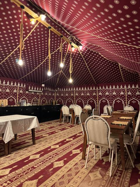       Lavishly decorated tent dining area.
  