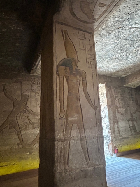       An ancient Egyptian temple with hieroglyphics and carvings.
  