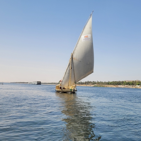Traditional sailboat on a river.