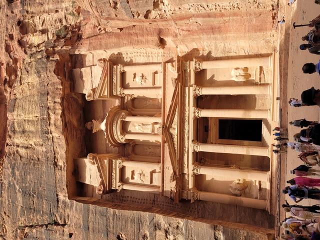 Tourists approaching the Treasury in Petra.