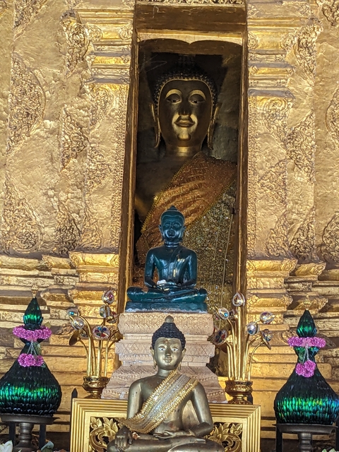       Emerald Buddha statue within a temple.
  