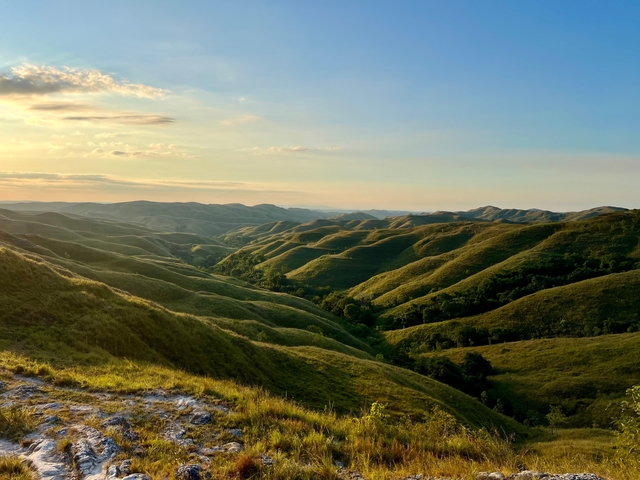       Rolling hills during a golden sunset.
  