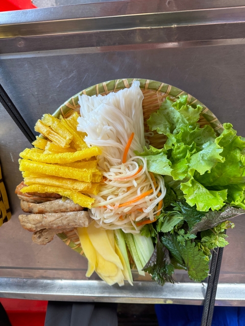 Plate of Vietnamese noodles with fresh vegetables.